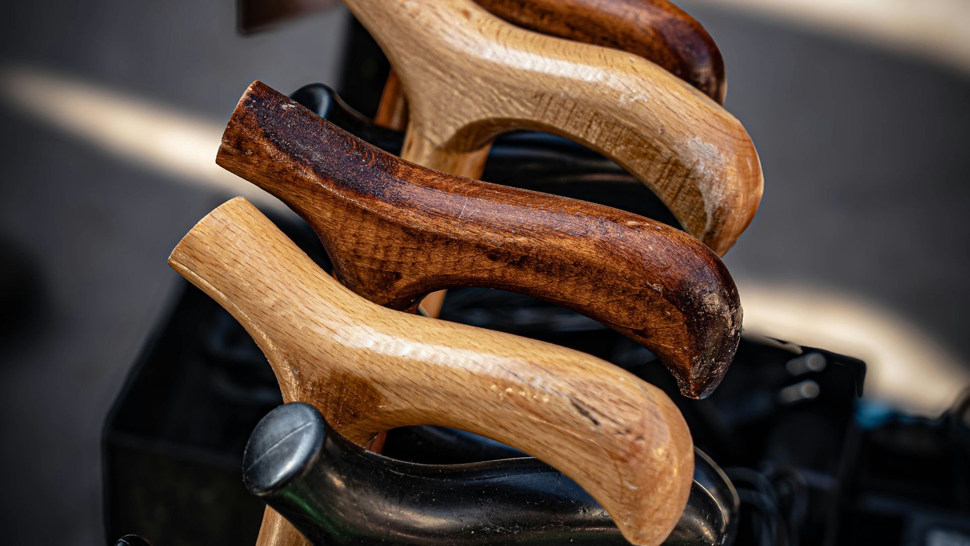 Several wooden cane handles arranged together