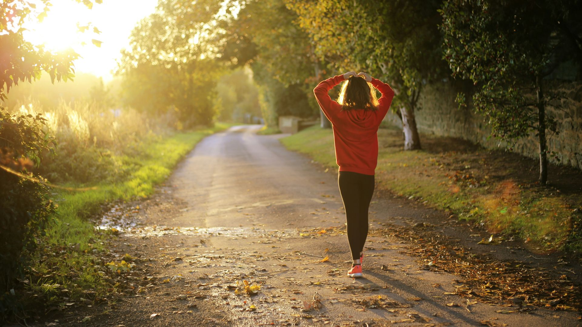woman walking on pathway during daytime