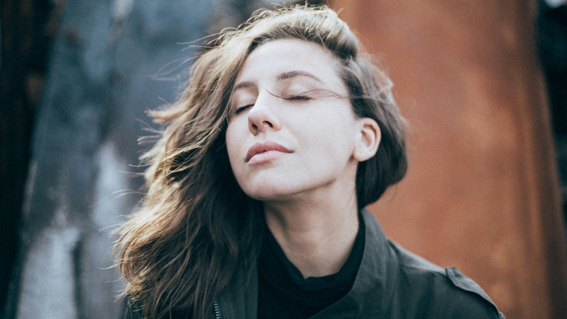 closeup photo of woman wearing black top