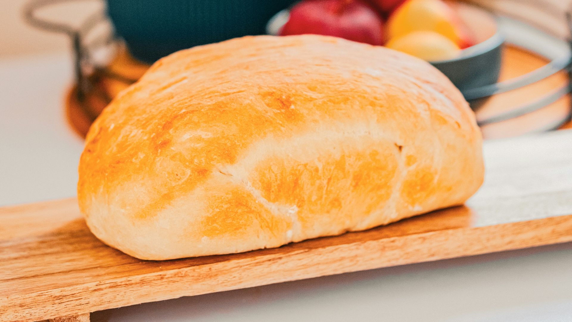 a loaf of bread sitting on top of a cutting board