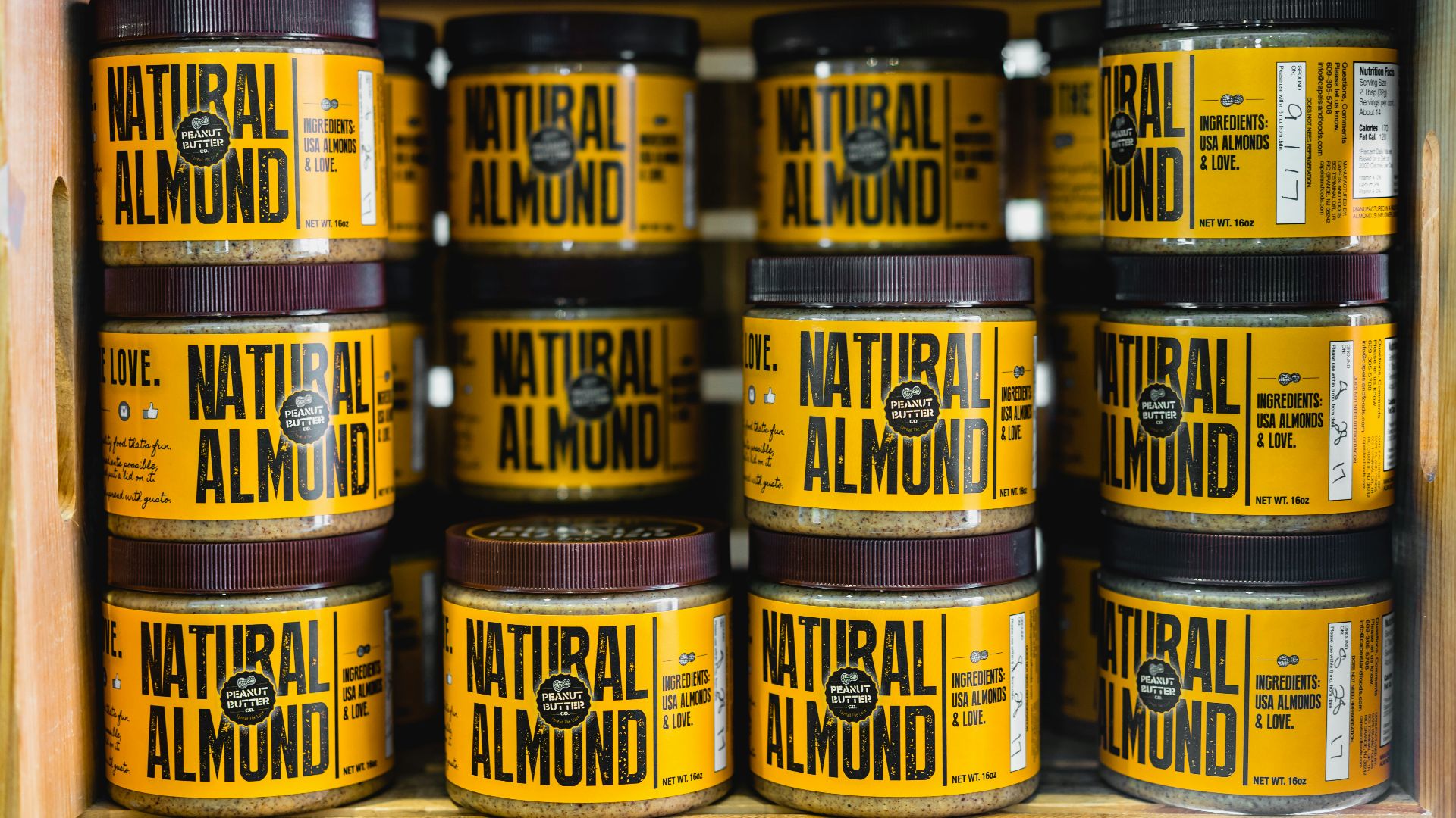 pile of Natural Almond bottles