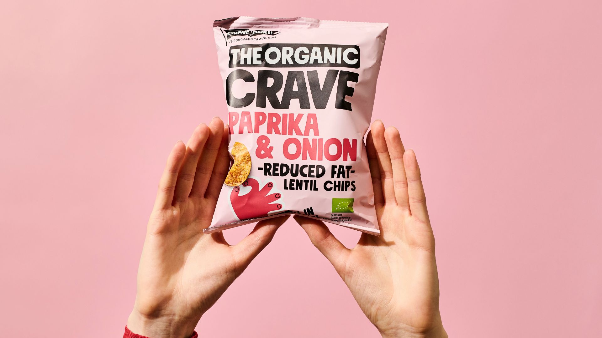 person holding kettle cooked potato chips