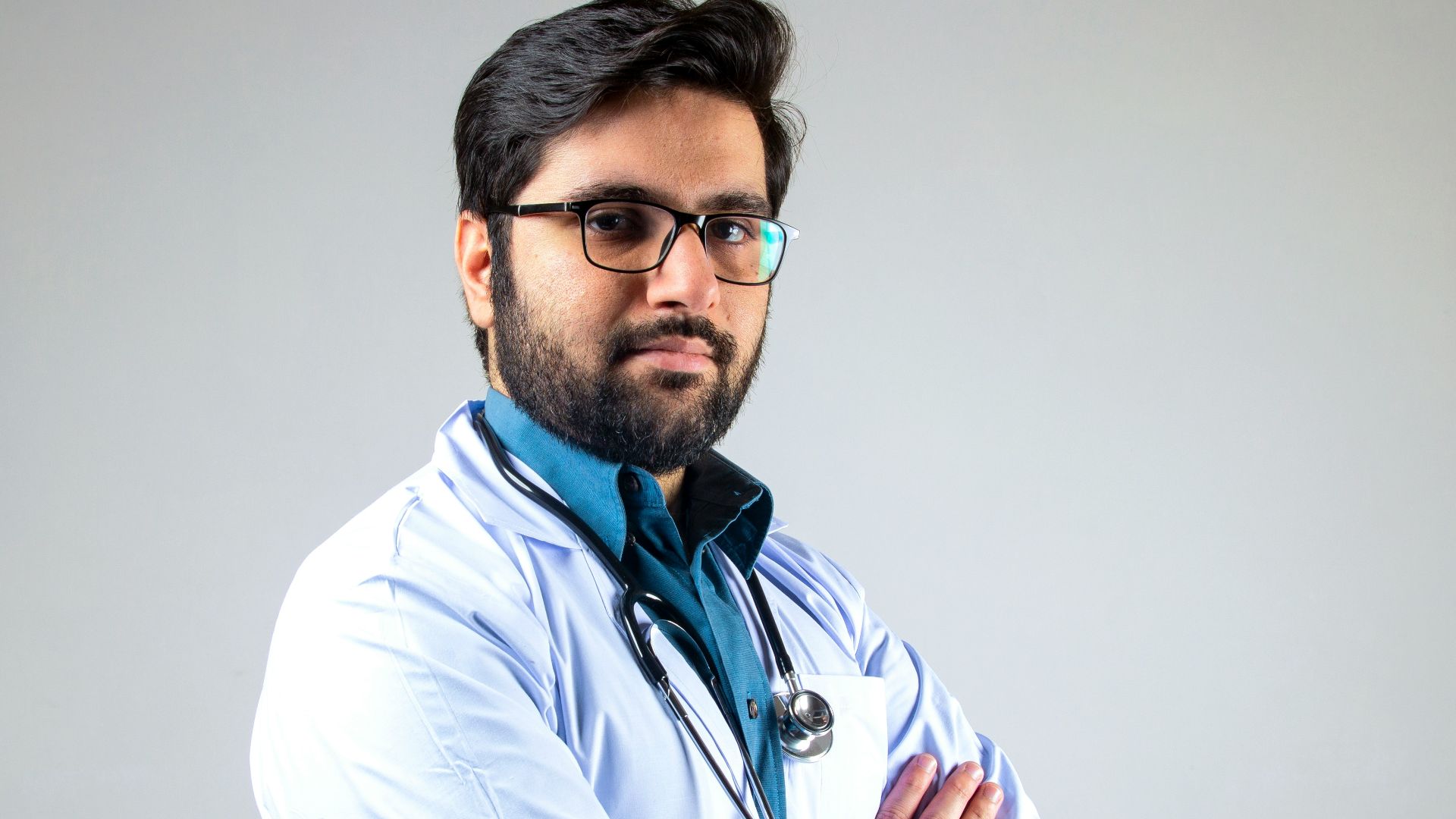 man in white dress shirt wearing black framed eyeglasses