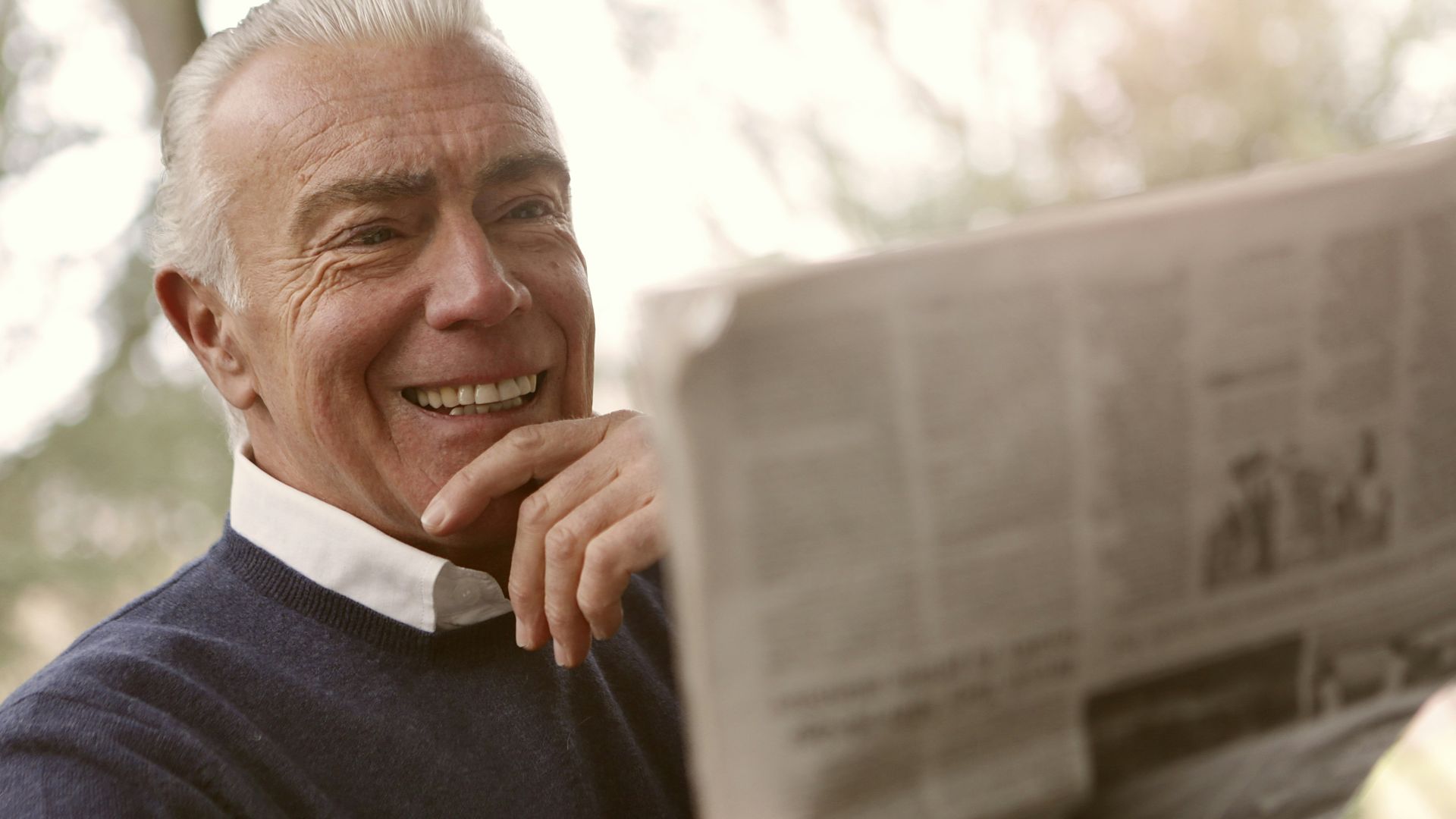 man reading newspaper