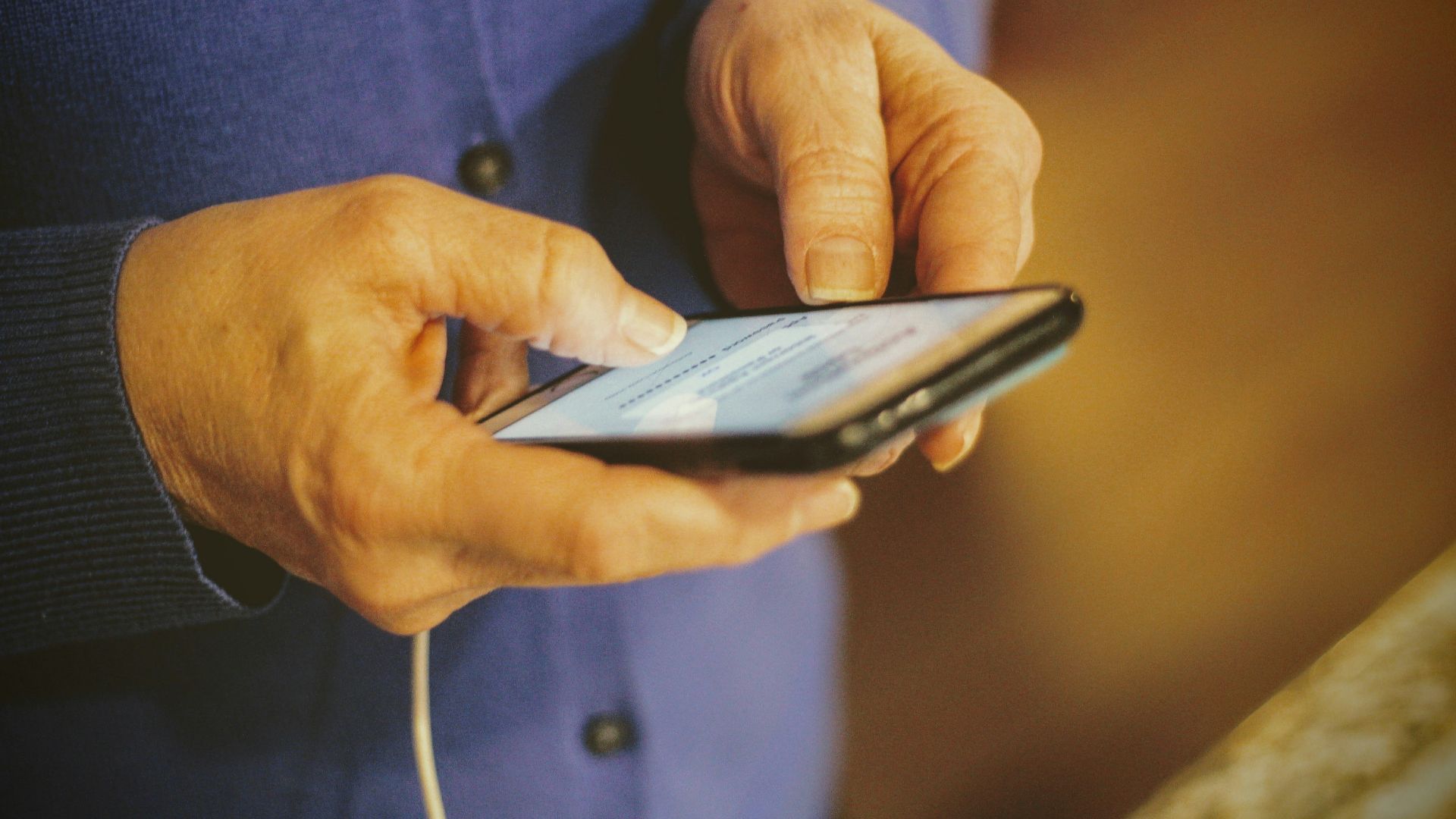 person holding silver iphone 6