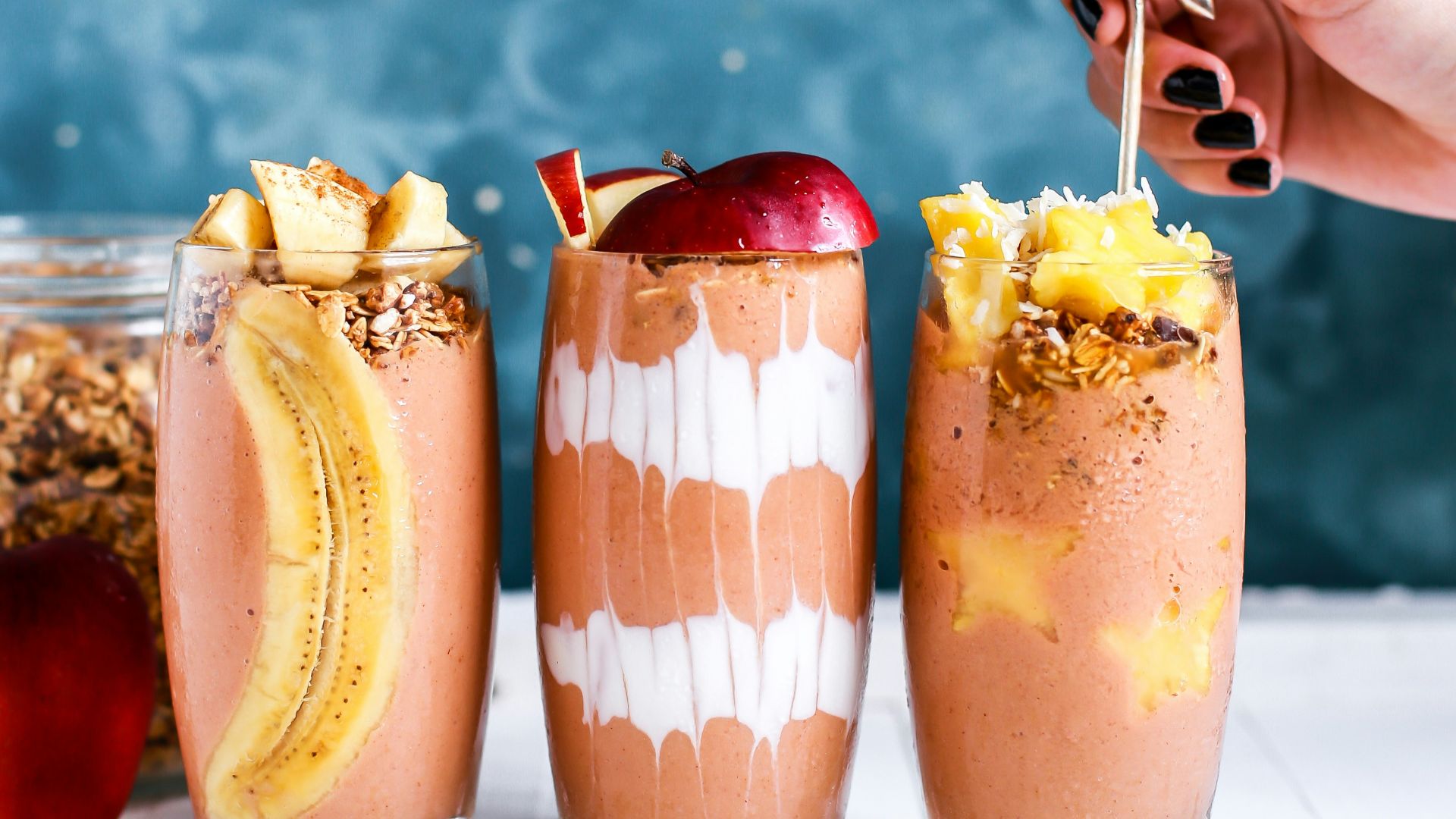 three clear drinking glass filled by shakes