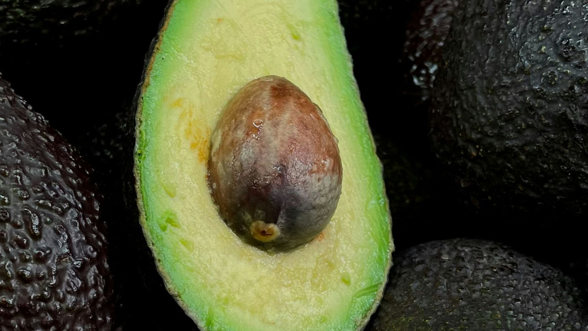 green and brown fruit on black and brown fruits