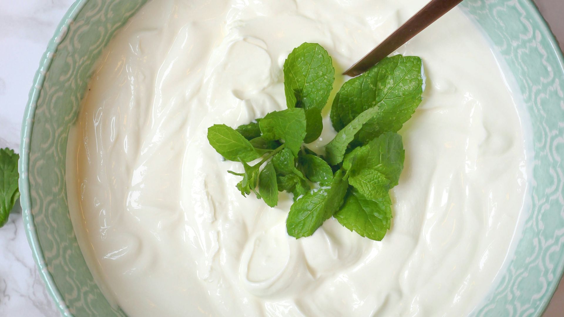 a bowl of yogurt with a spoon in it