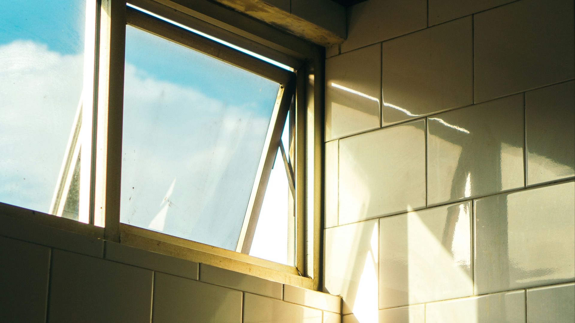 a shadow of a person standing in front of a window