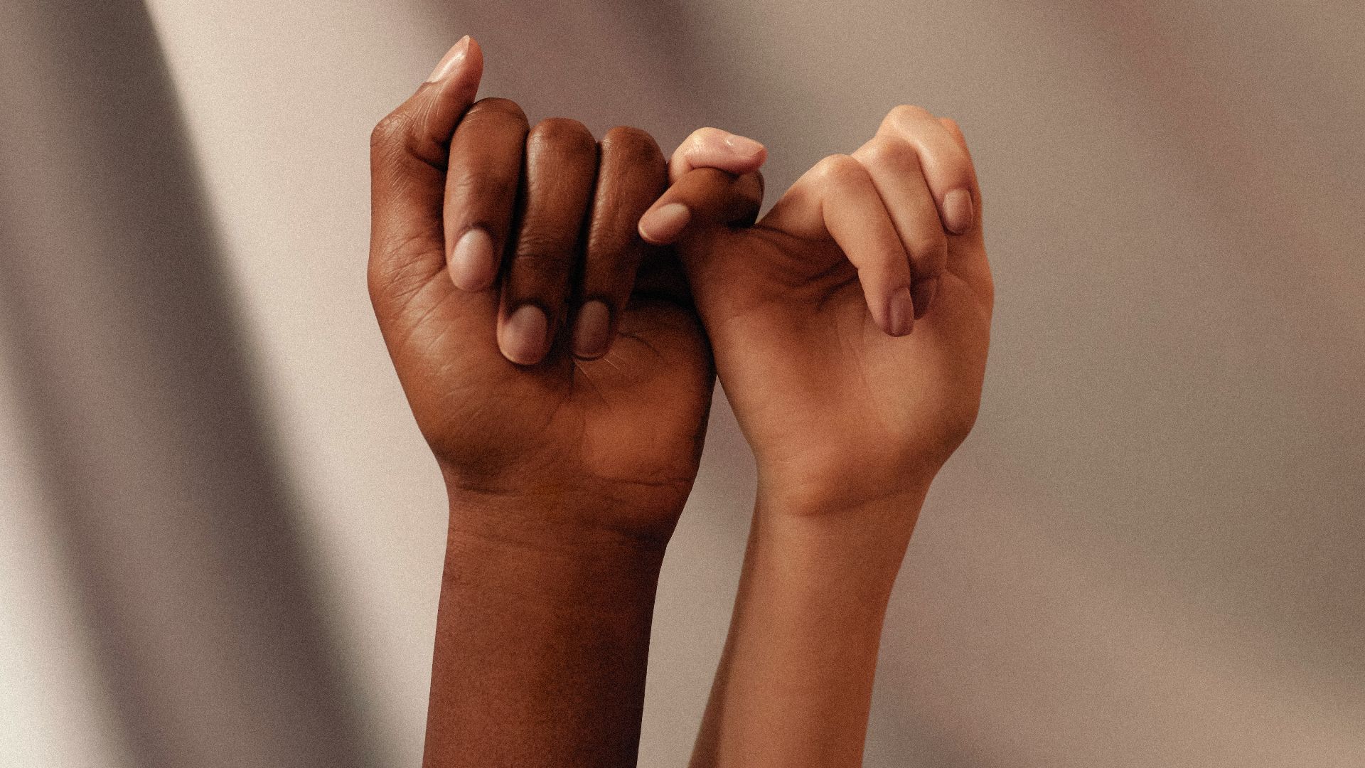 persons hand with white manicure