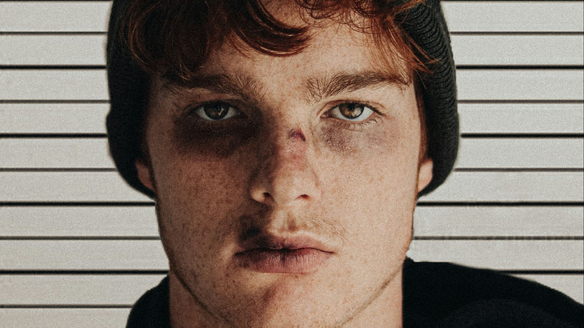 man in black knit cap and black hoodie