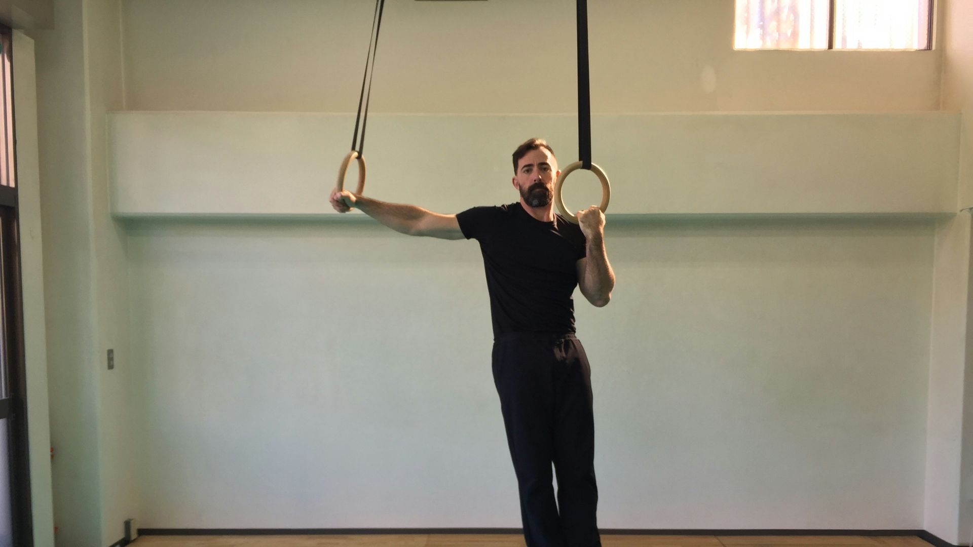 a man hanging upside down on a rope