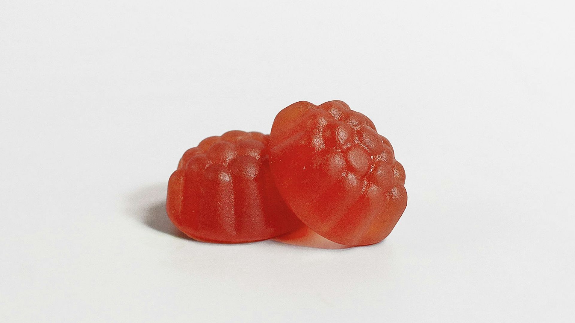 a red strawberry on a white background