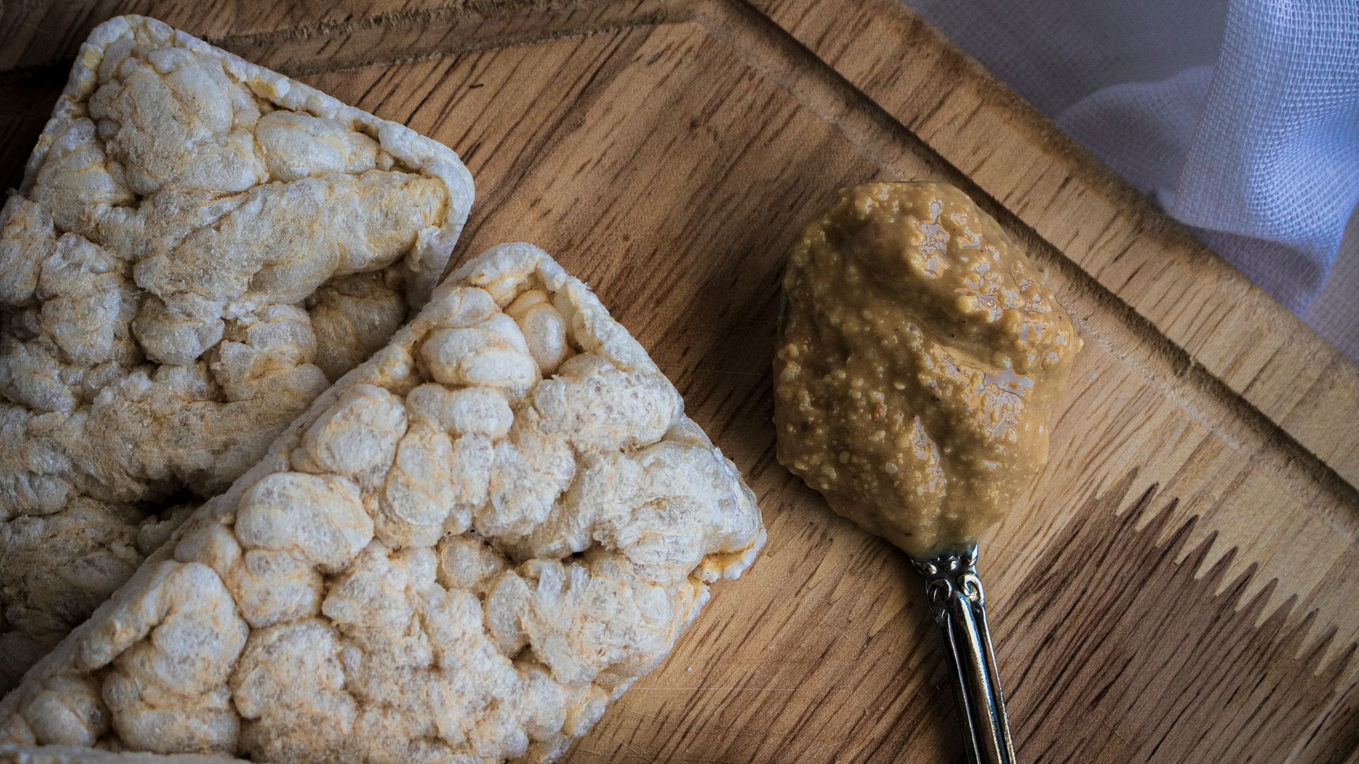a wooden cutting board topped with food next to a knife