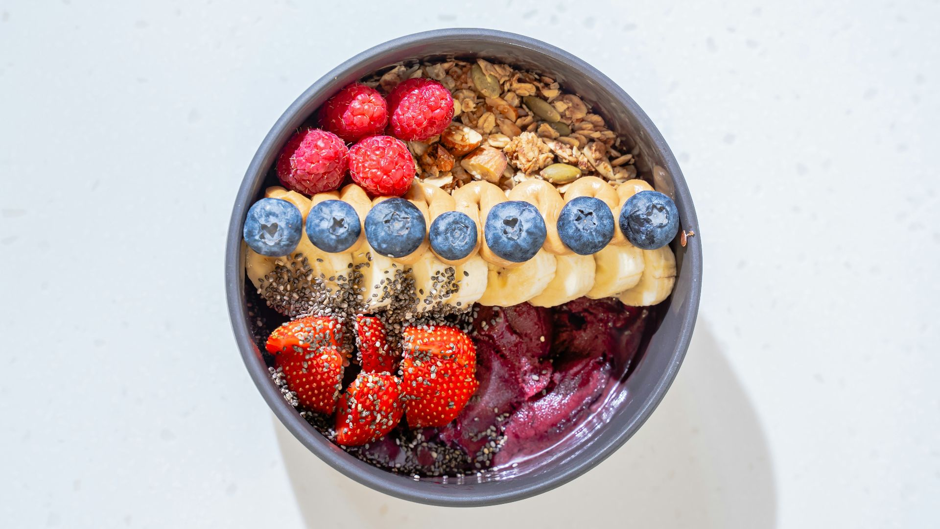 a bowl of cereal with milk and fruit
