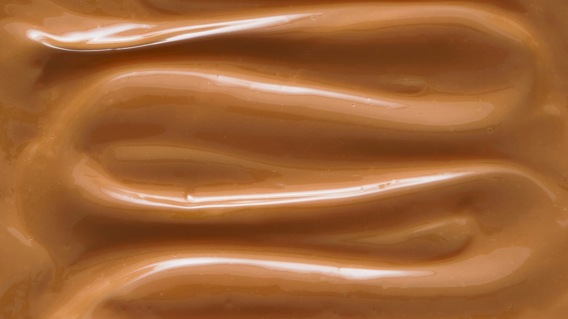 A close up of a chocolate frosted surface