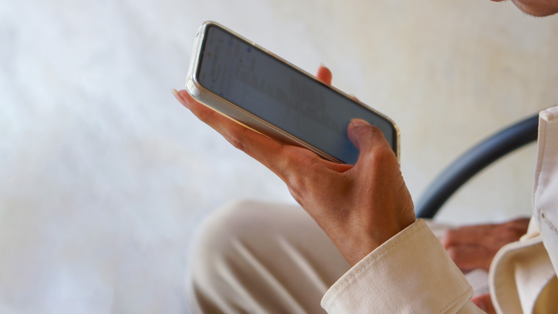 a close up of a person holding a cell phone