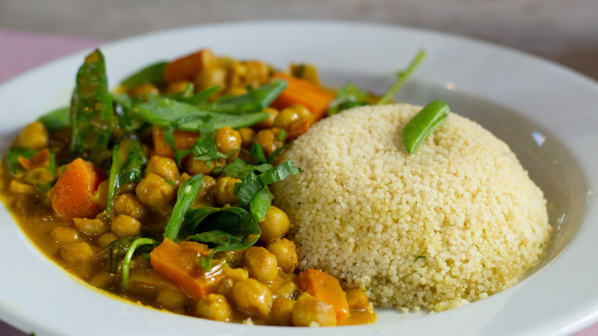 rice with green leaf vegetable on white ceramic plate