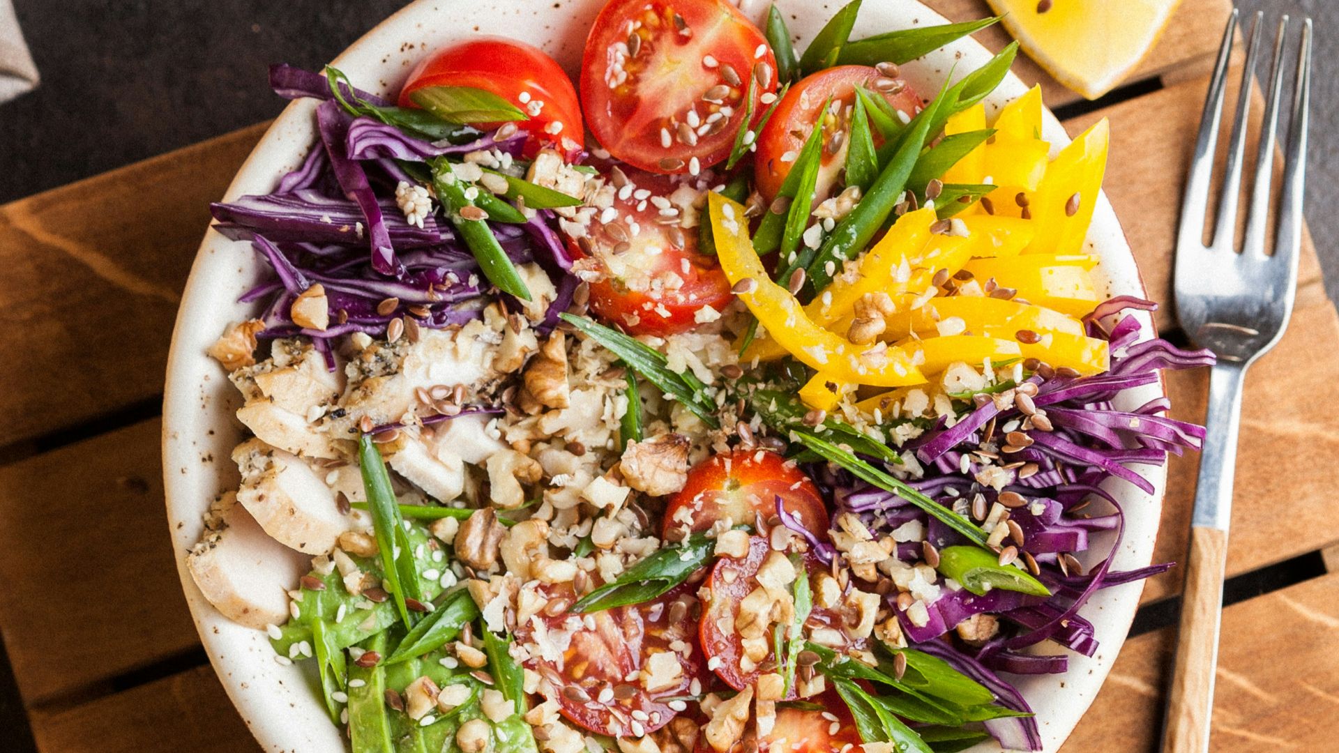 plate full of salad with spice on top of brown board