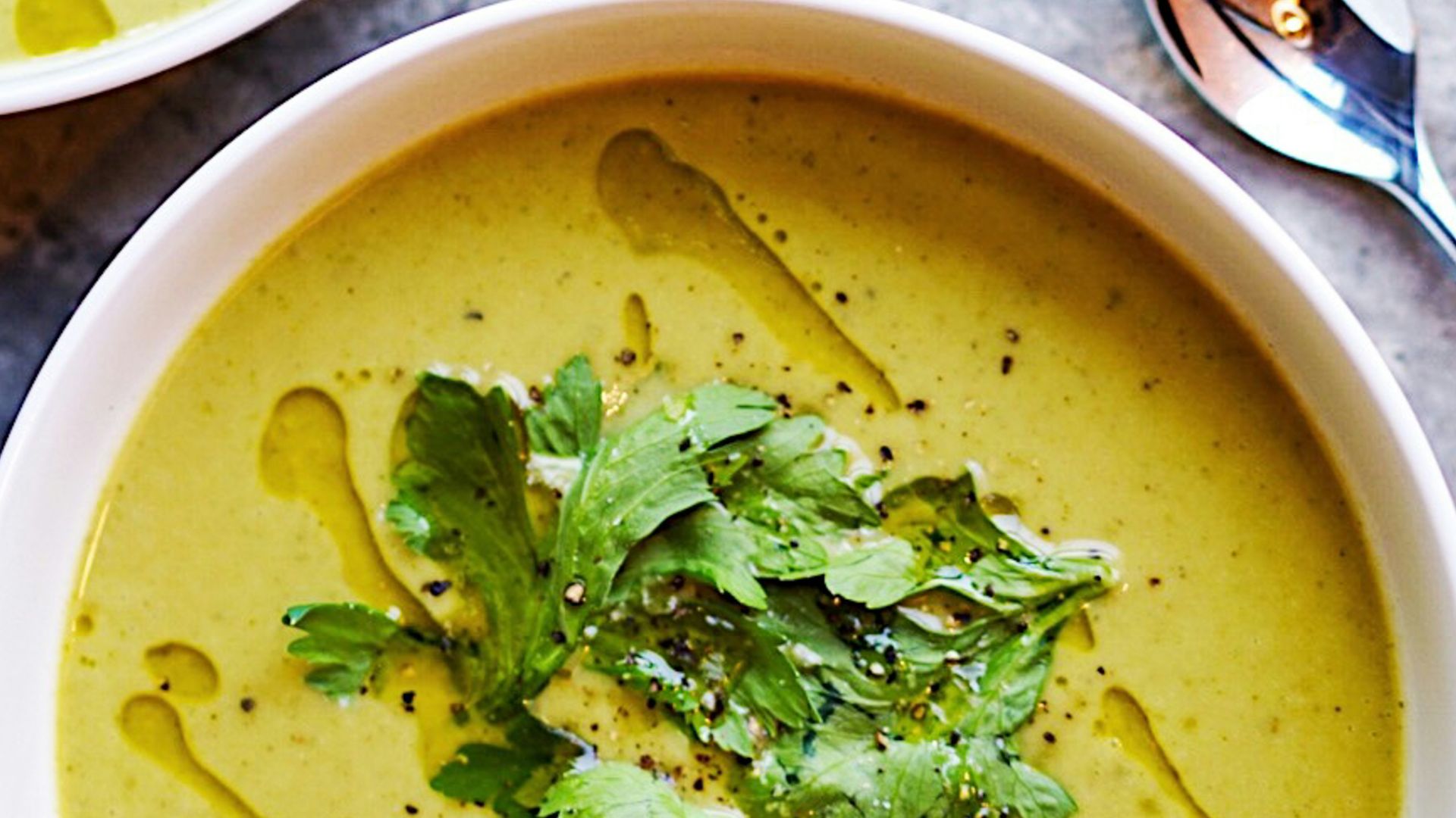 green soup on white ceramic bowl
