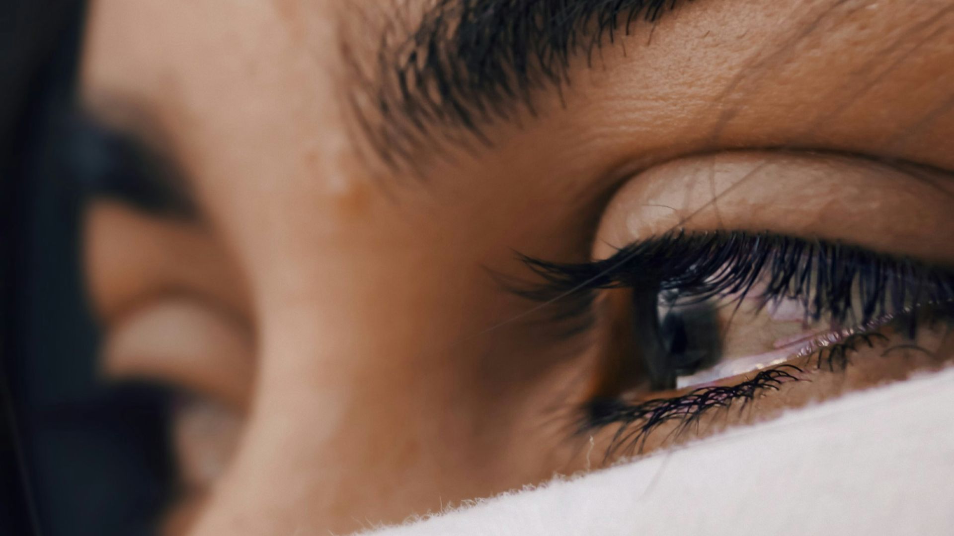 shallow focus of a woman's sad eyes