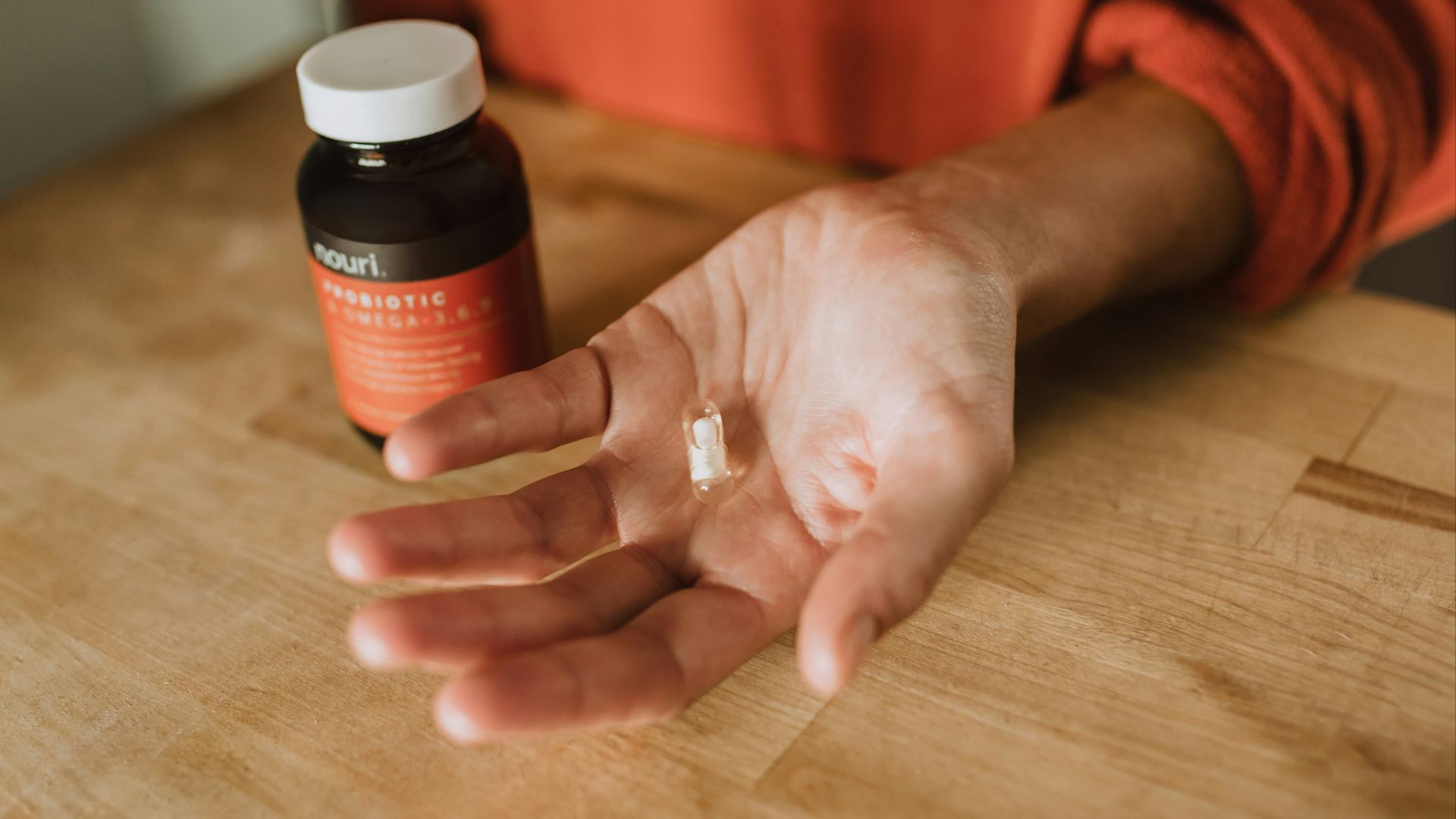 person holding medication pill
