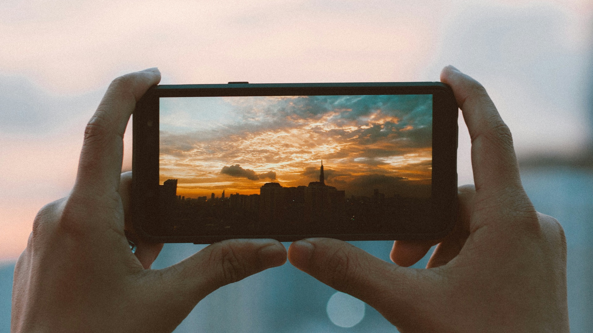 hands holding a tablet