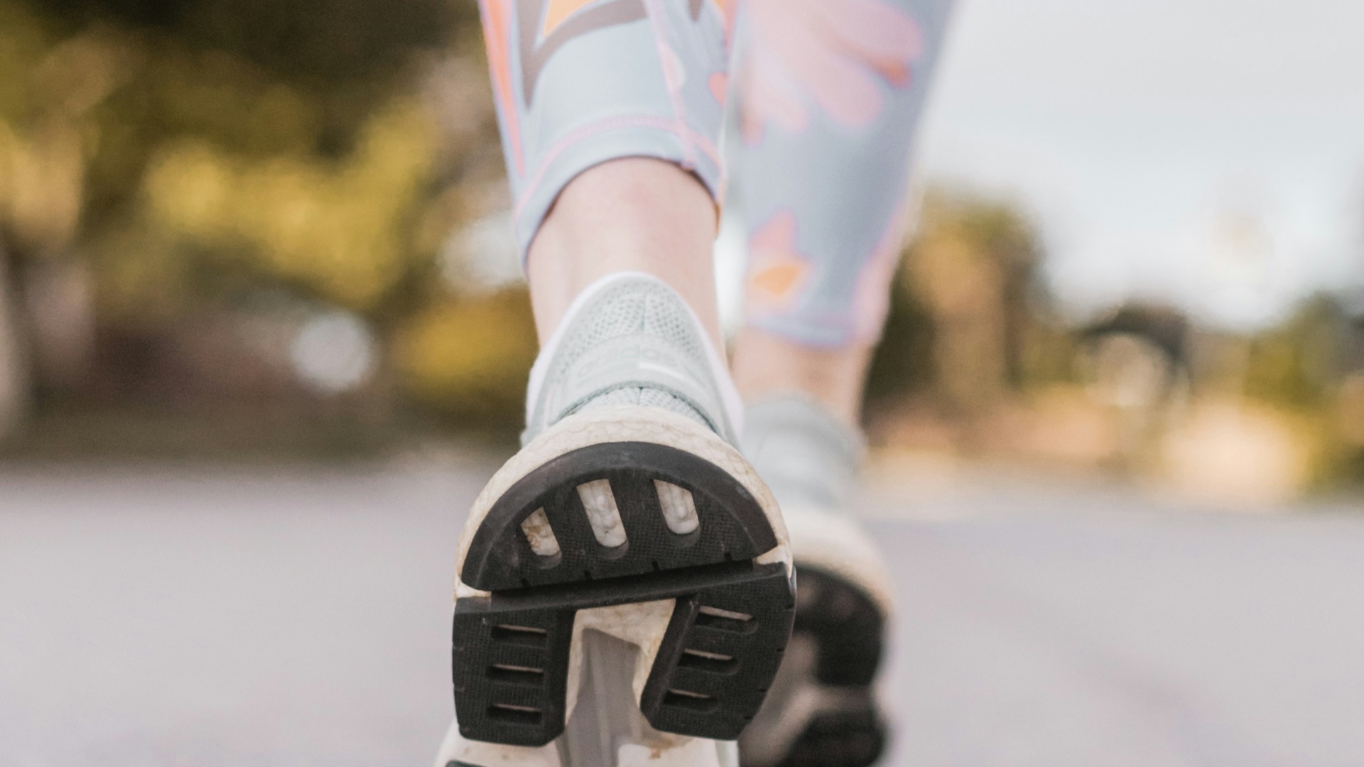 person wearing black and white nike shoes