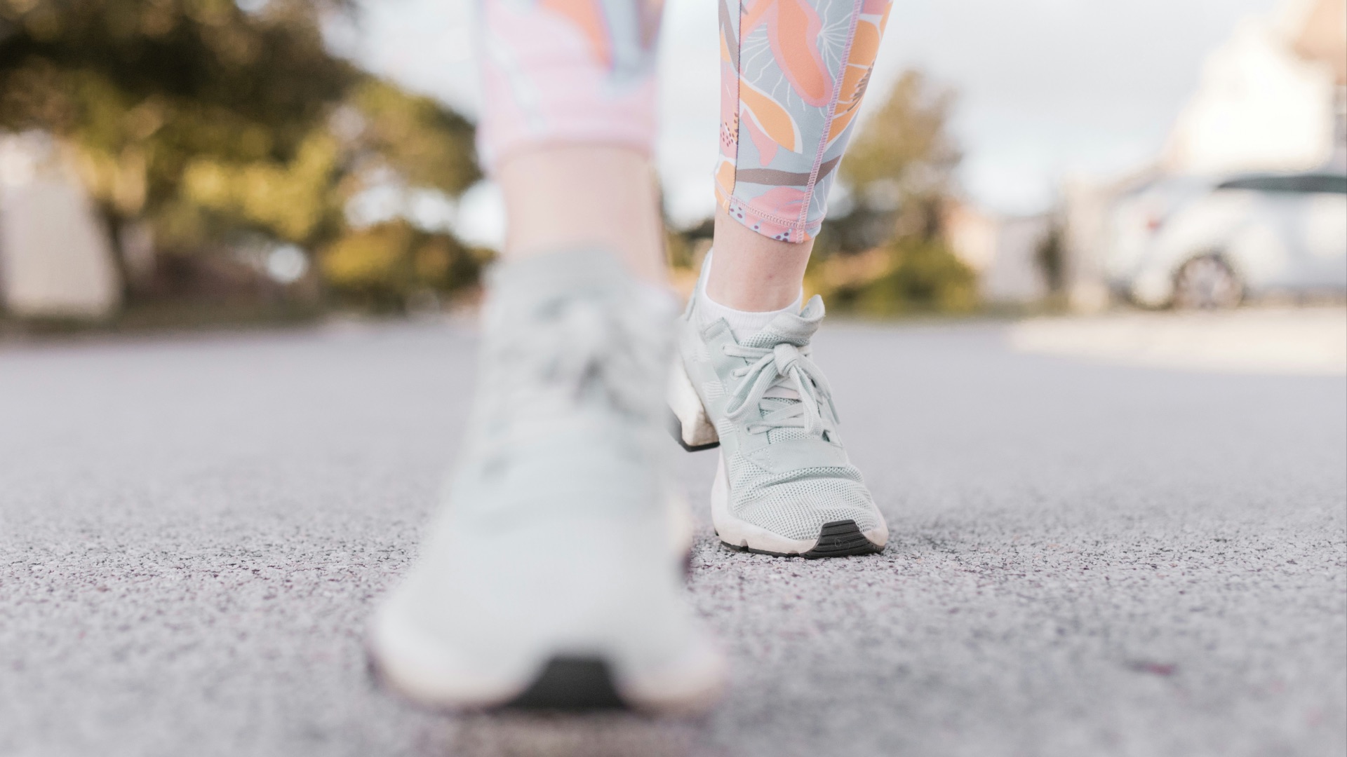 person in white nike sneakers