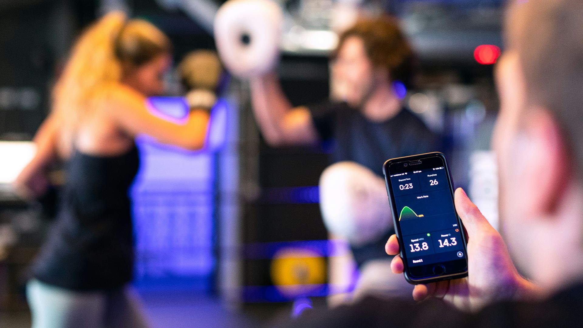 person holding black smartphone taking photo of man in black shirt