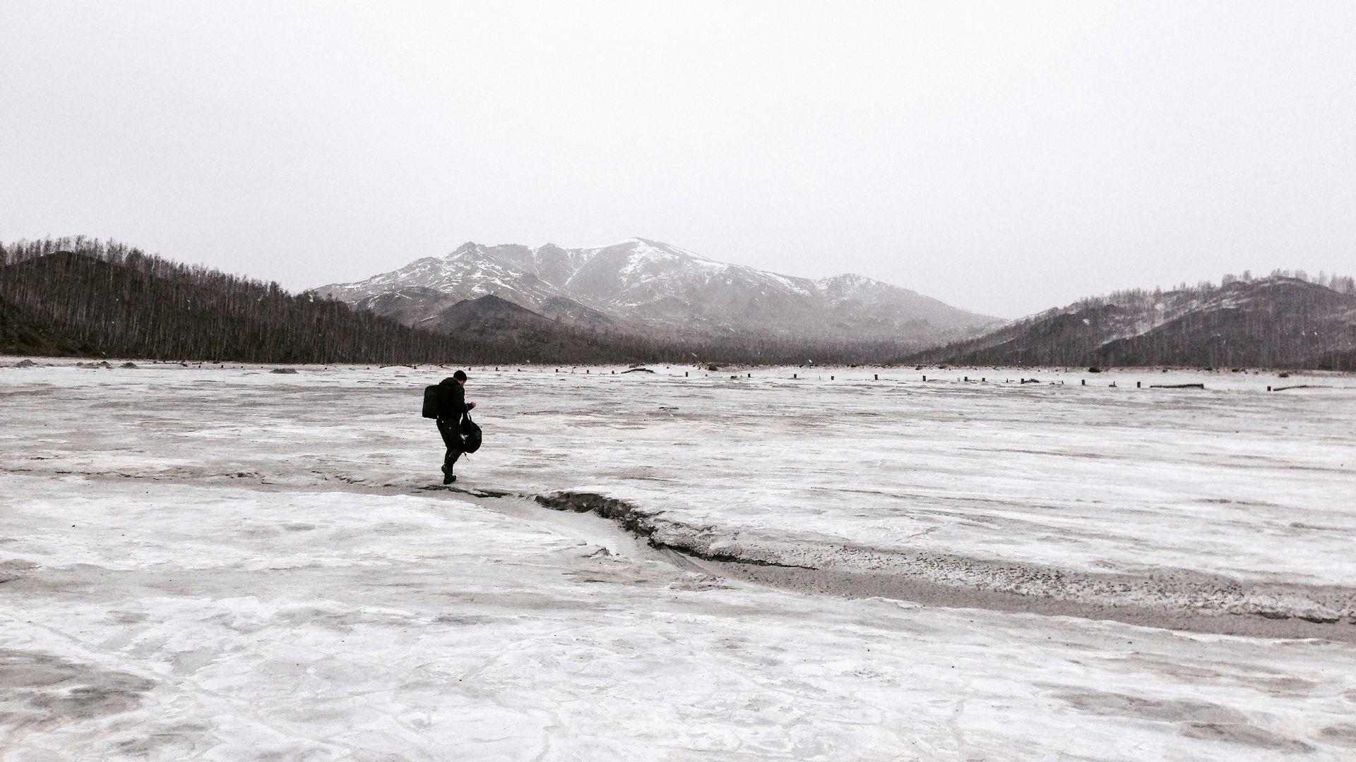 person walking on snow coated groudn