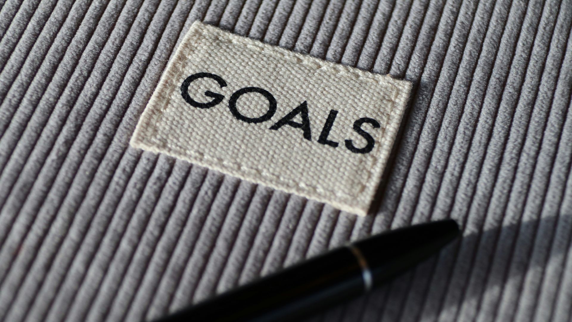 black and silver pen on gray textile