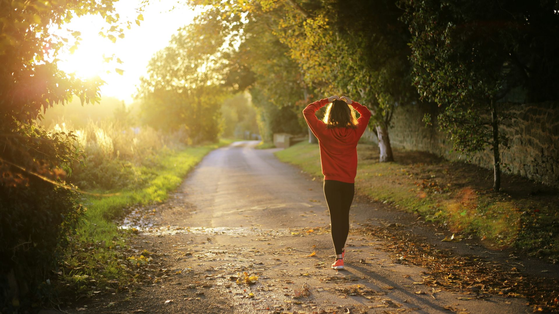 woman walking on pathway during daytime