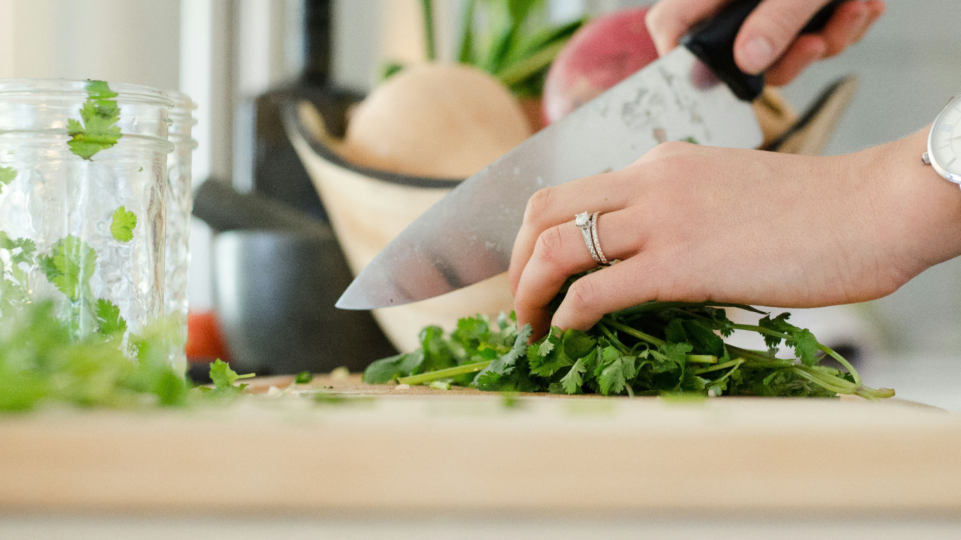 person cutting vegetables with knife