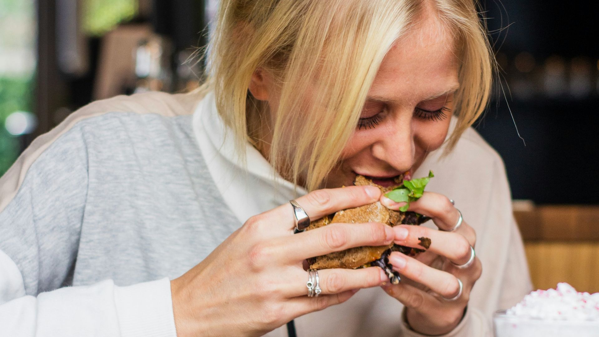 woman eating burger