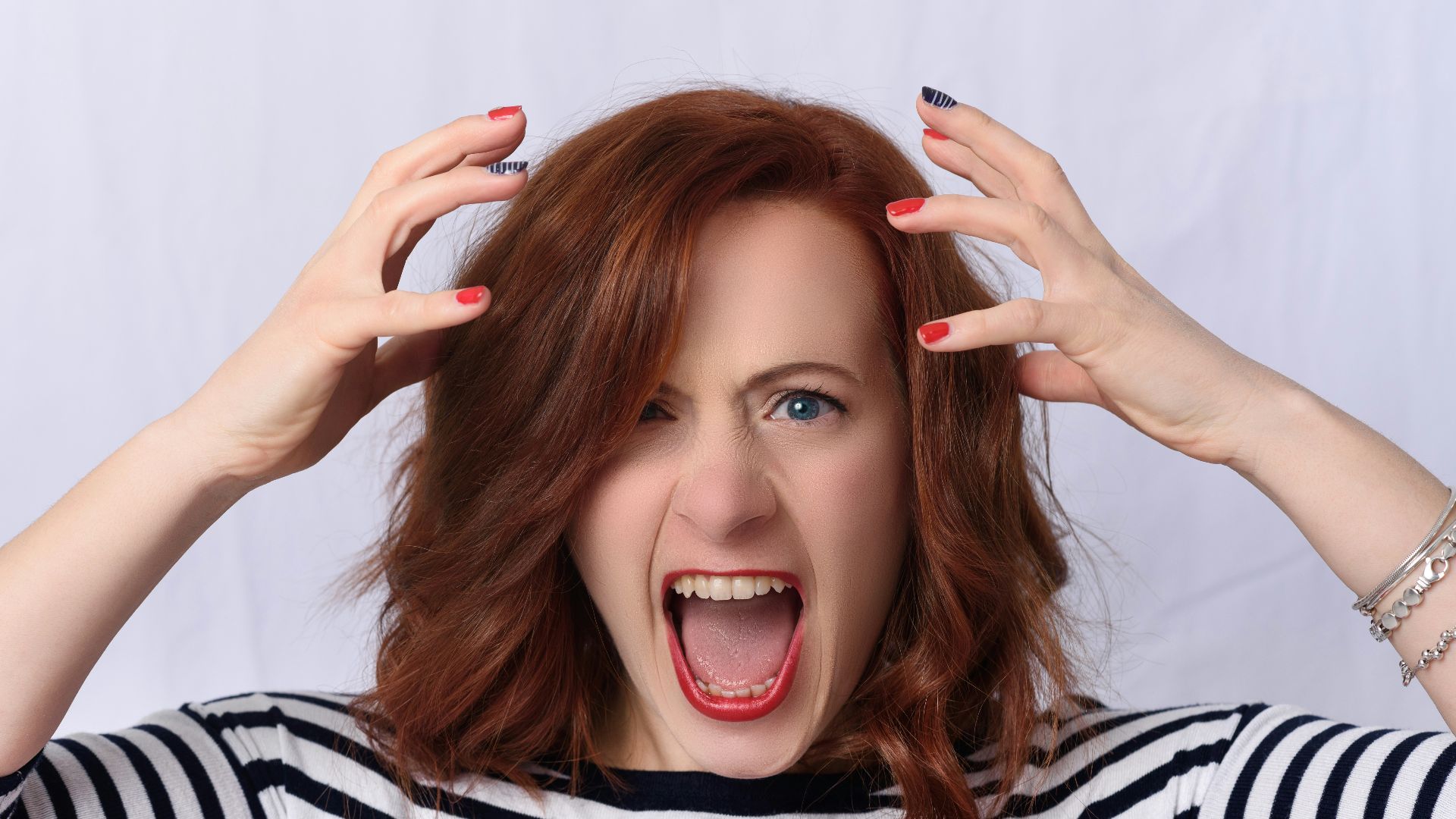 smiling girl in black and white striped shirt