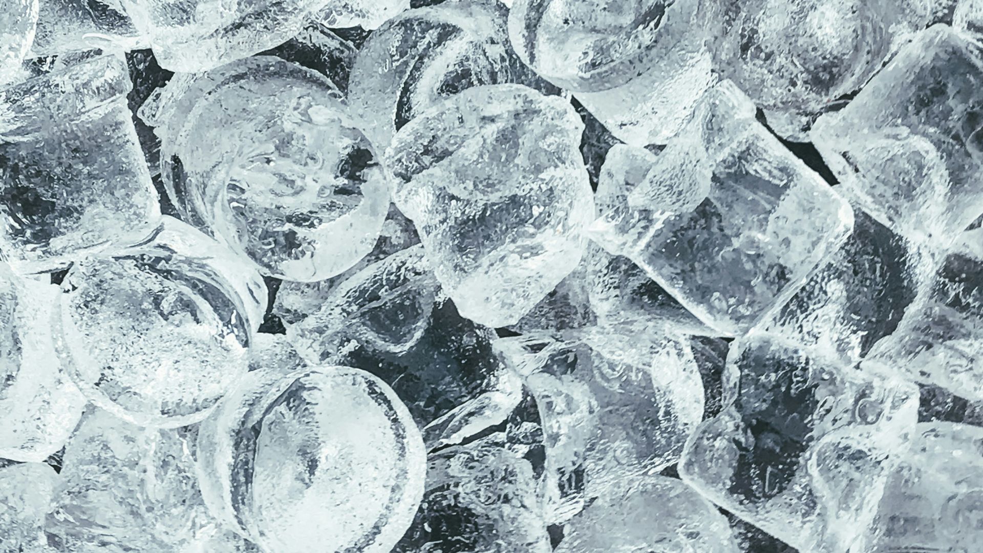 clear glass round ornament on gray stone