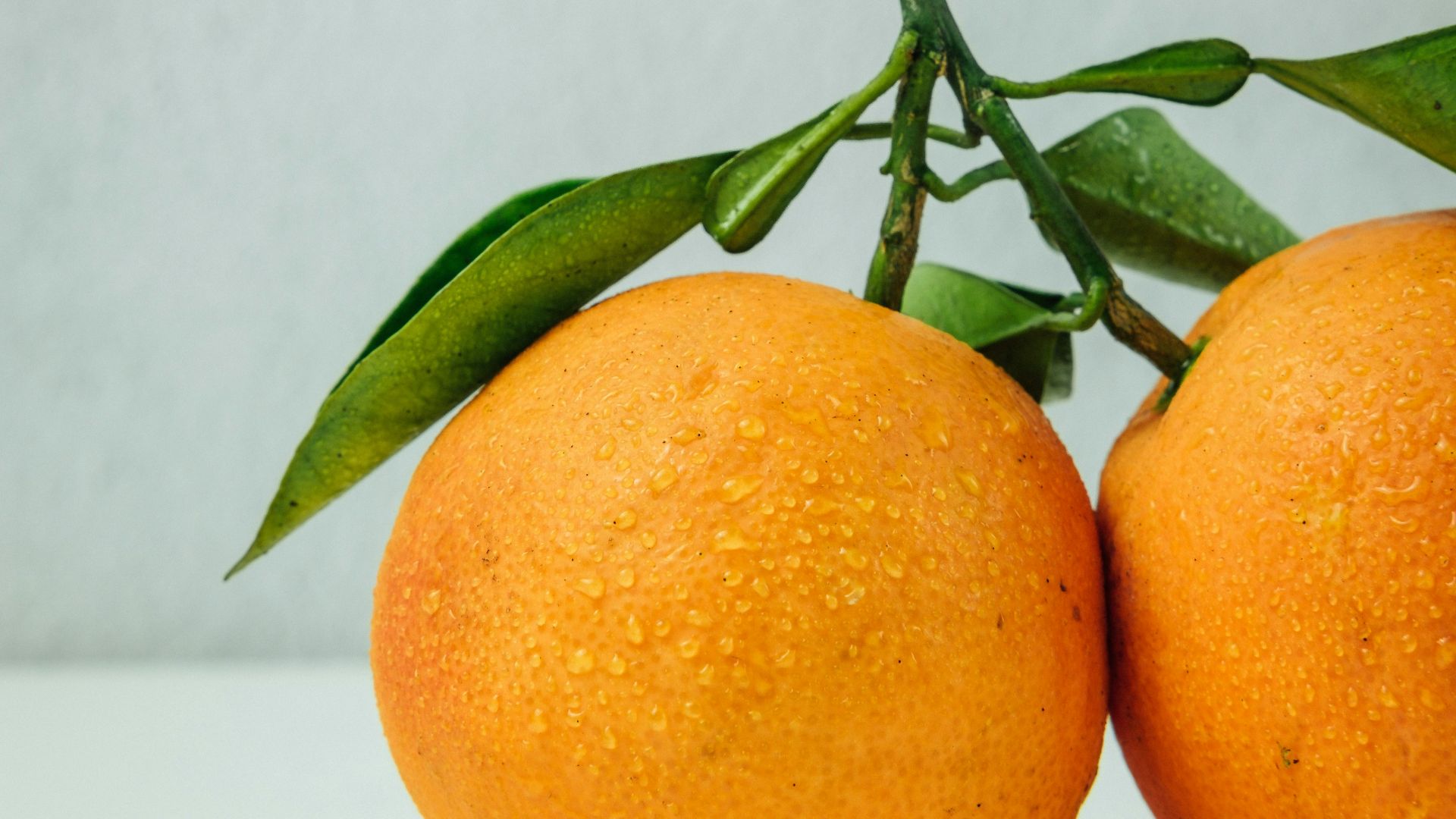 two orange fruits on table