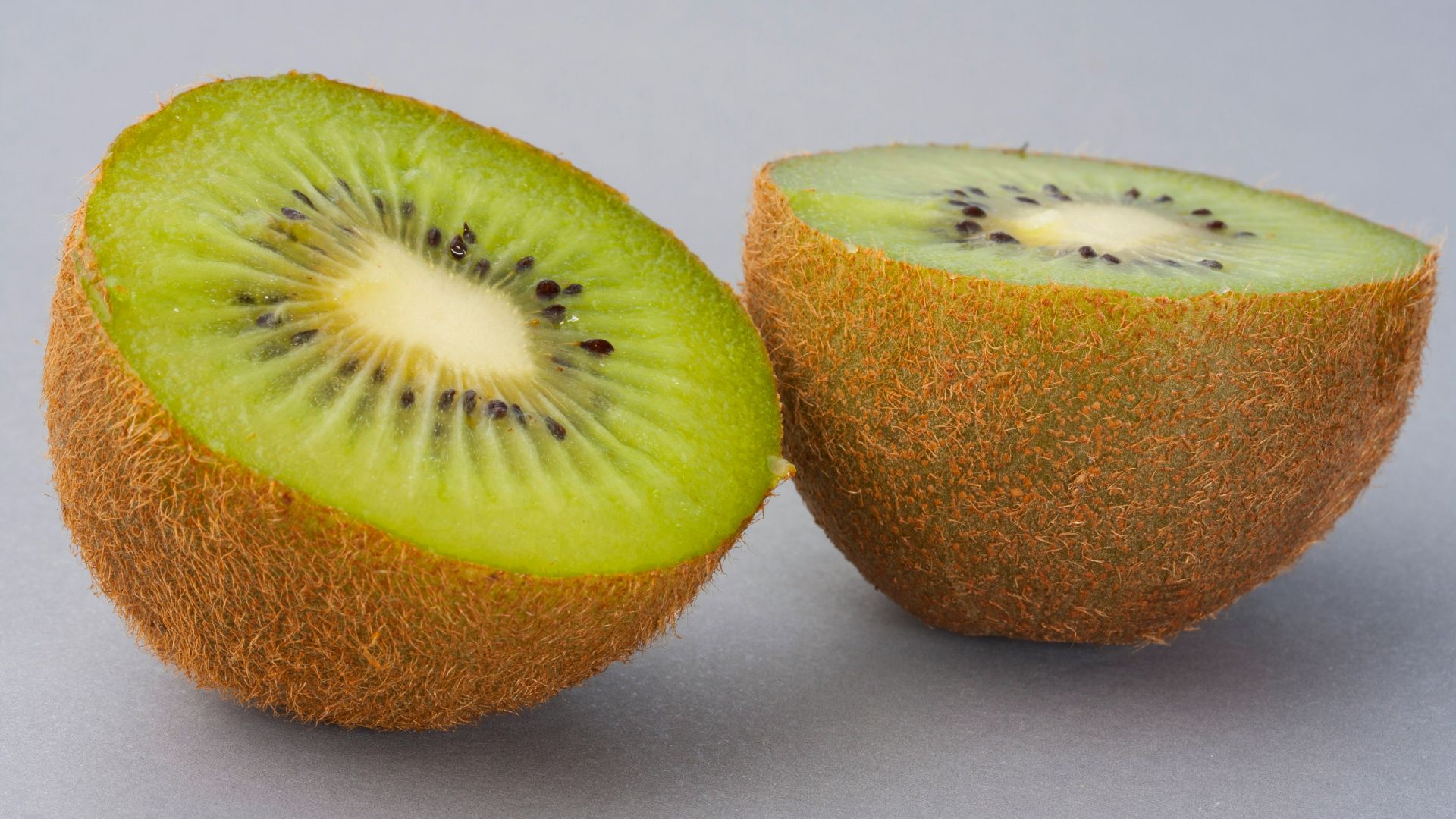 sliced green fruit on white surface