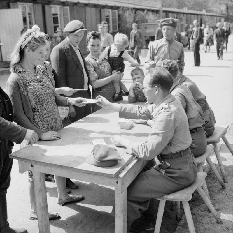 File:A Polish family registering at No.17 Displaced Persons Assembly Centre in Hamburg Zoological Gardens, 18 May 1945. BU6634.jpg