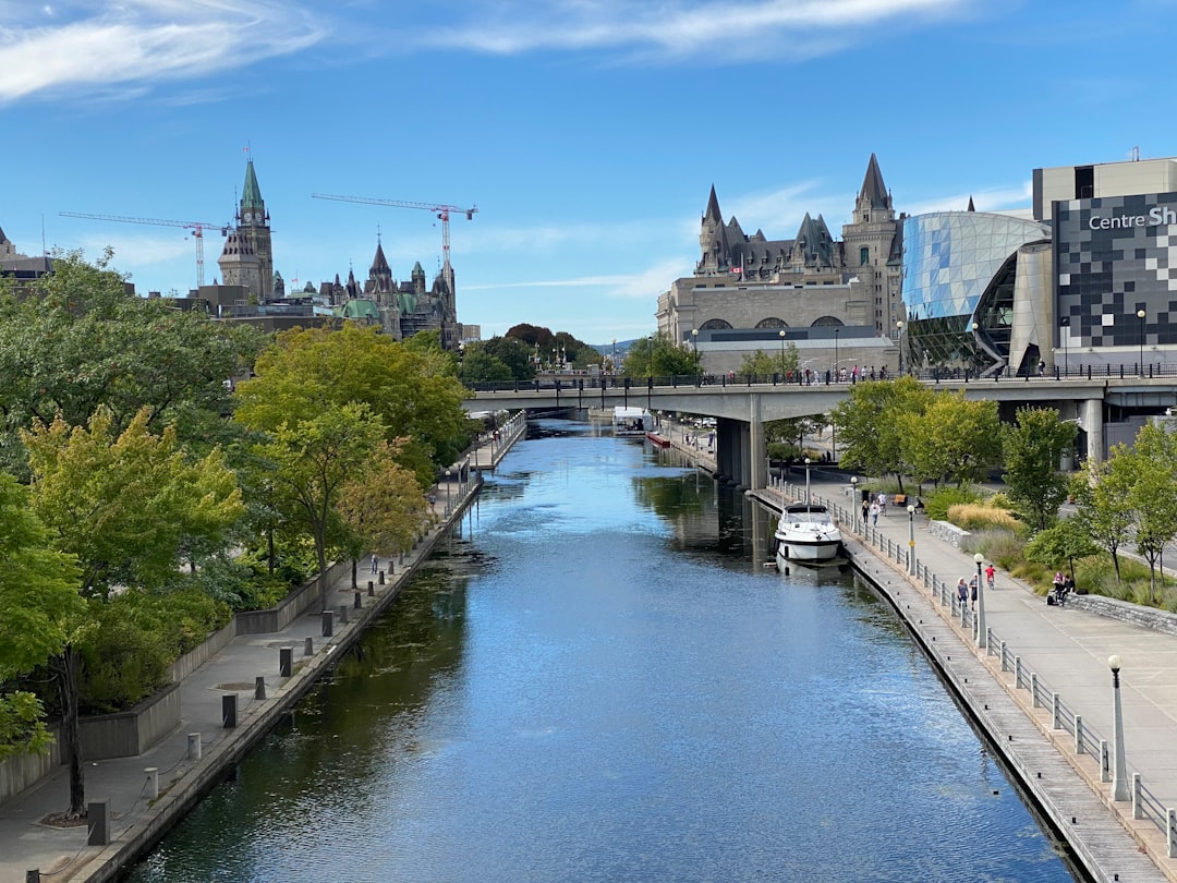 a river running through a city next to tall buildings
