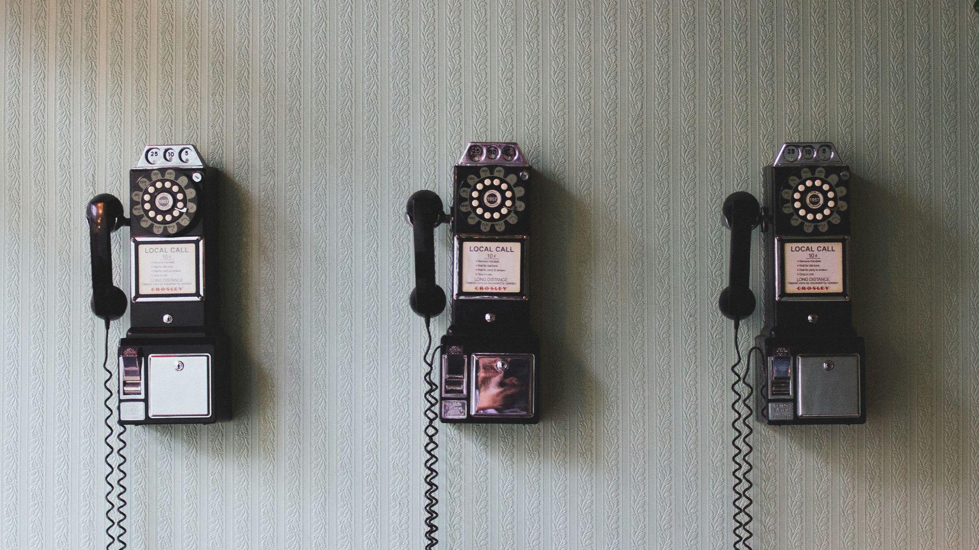 minimalist photography of three crank phones