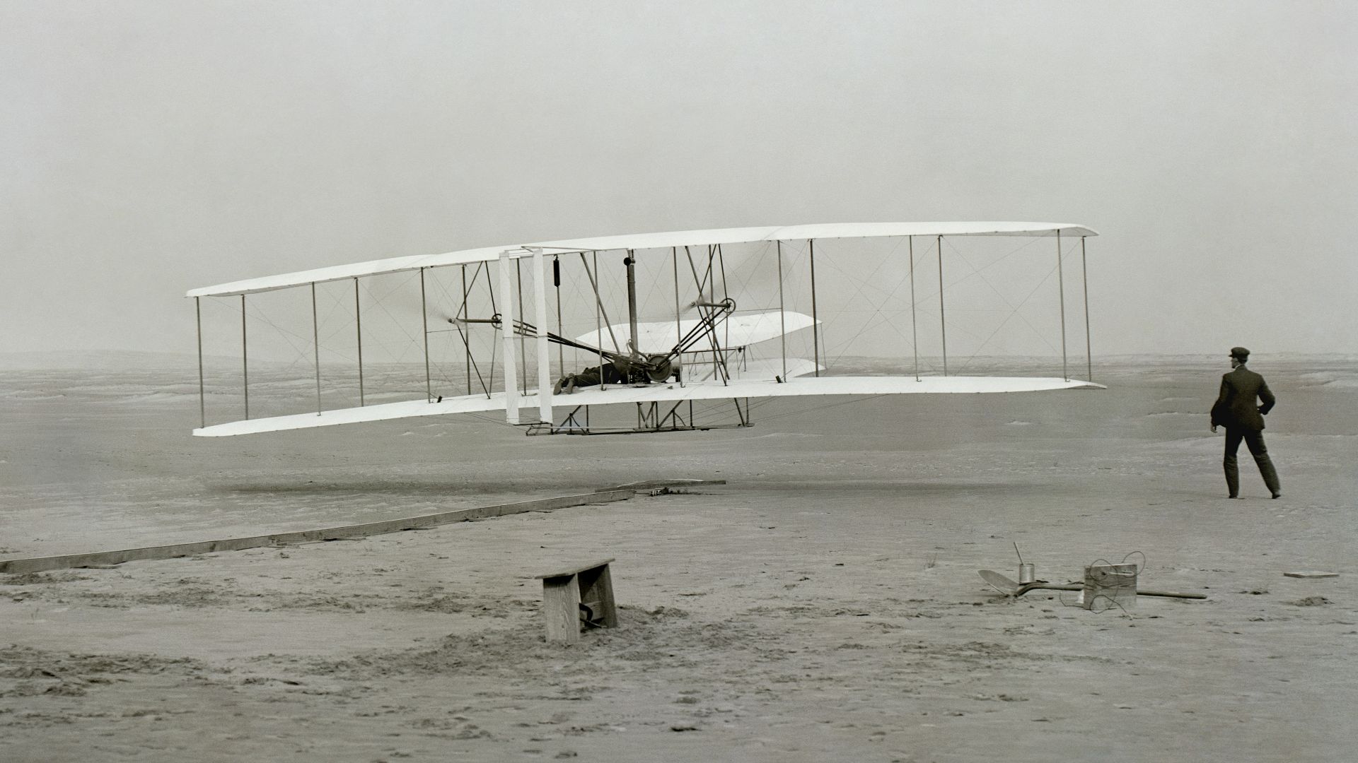 white metal fence on white sand during daytime