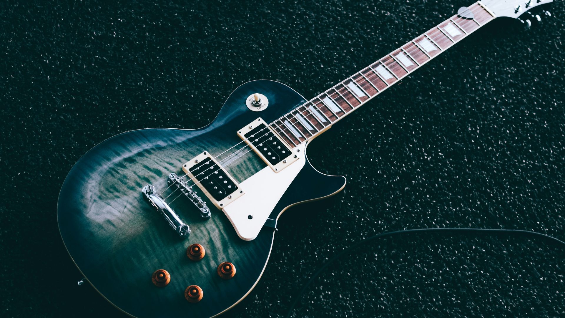 black whiskered single-cutaway electric guitar