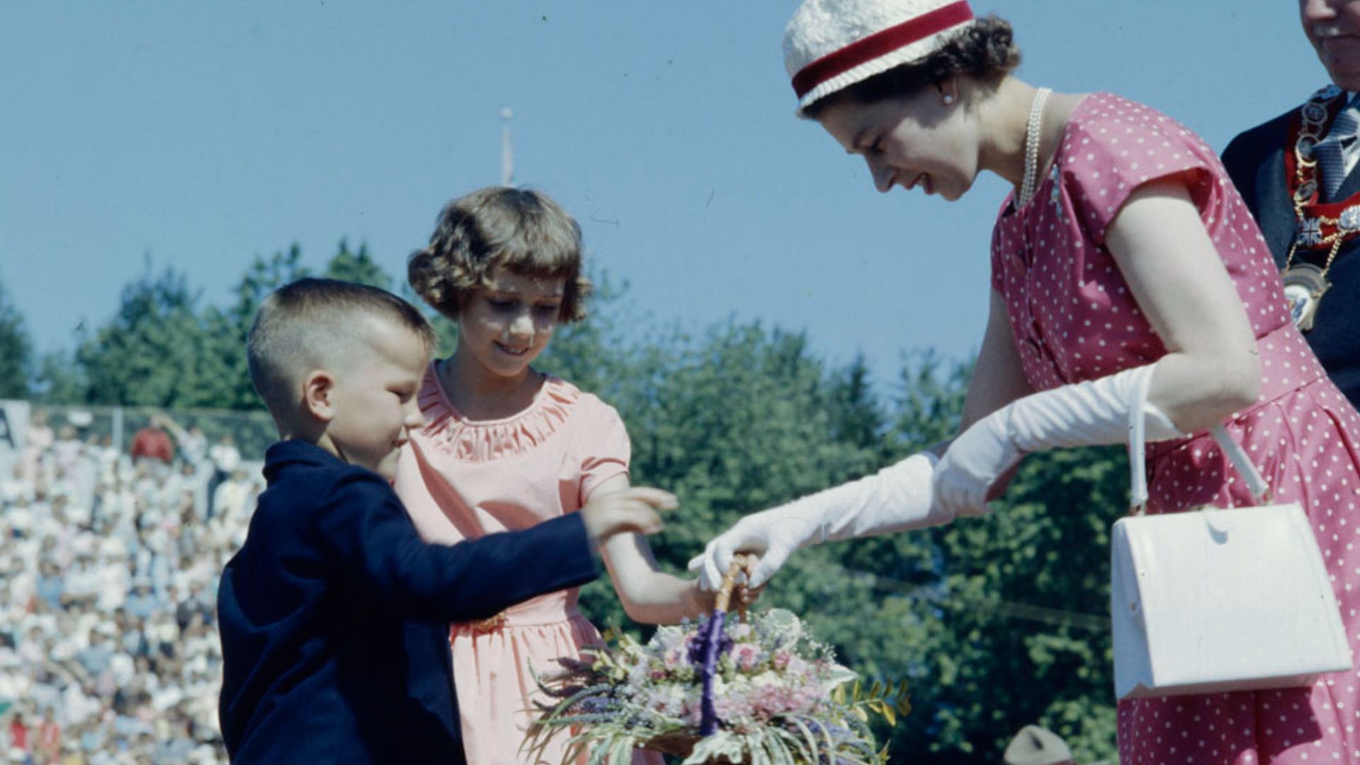 File:Queen Elizabeth receiving a basket of flowers.jpg
