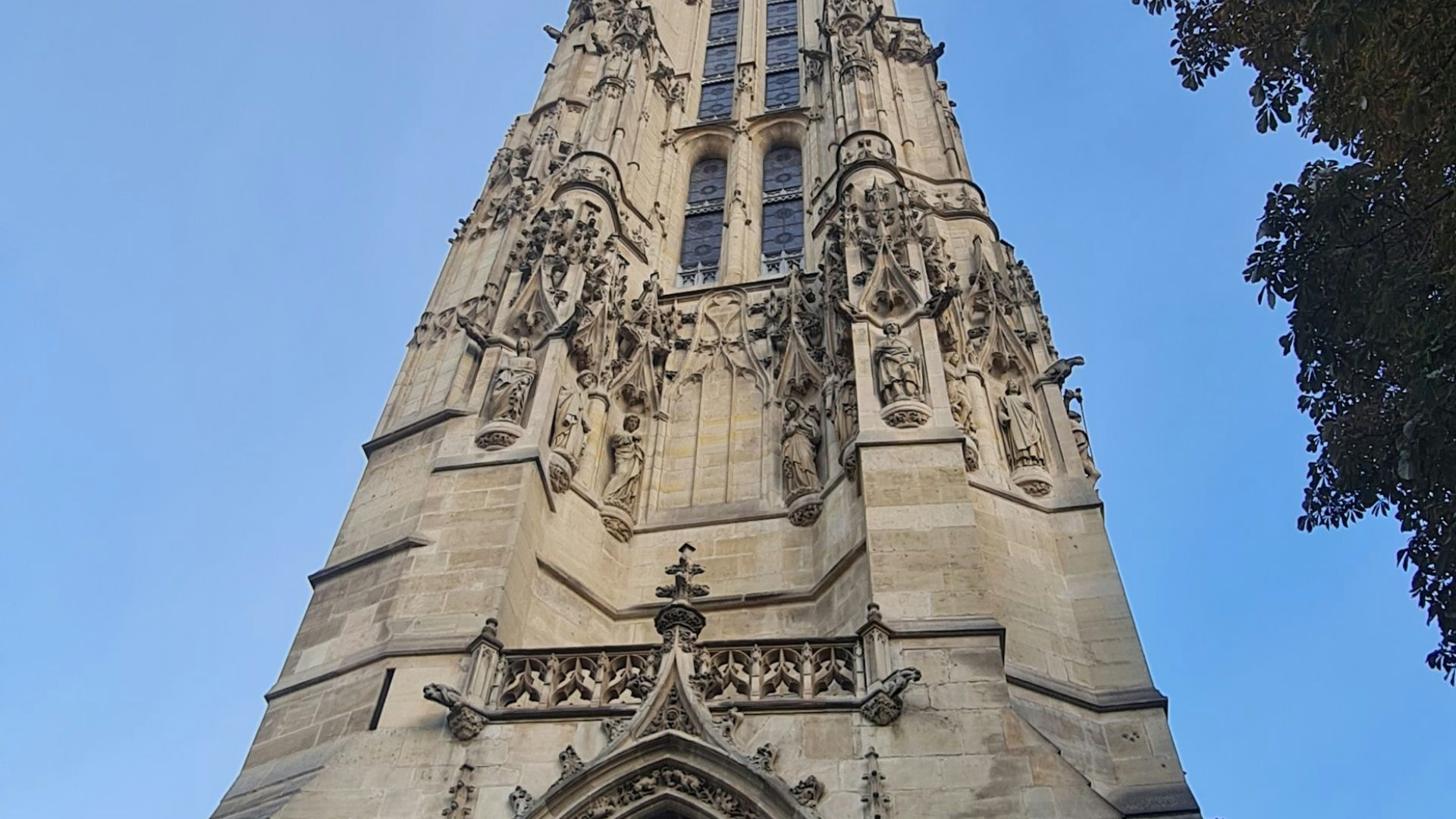 a tall tower with a clock on the top of it
