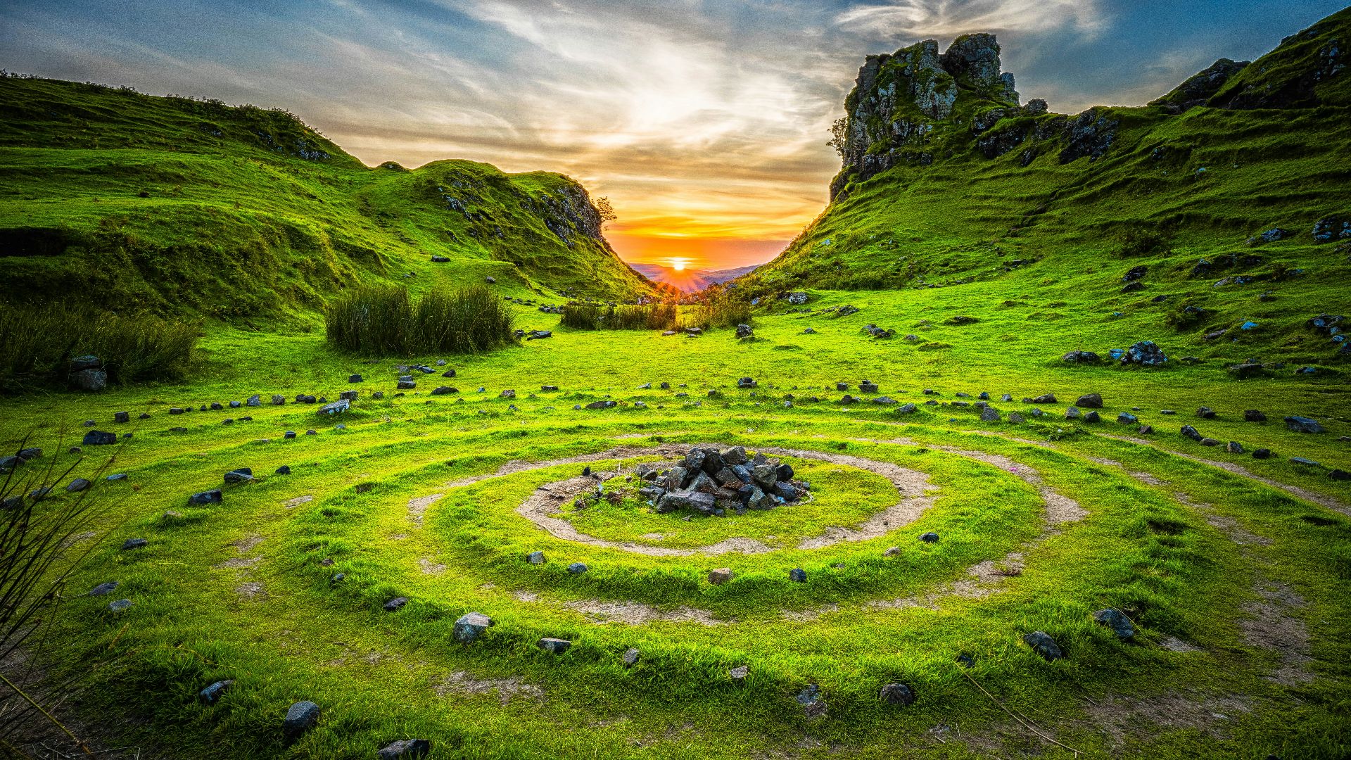 green grass field during sunset