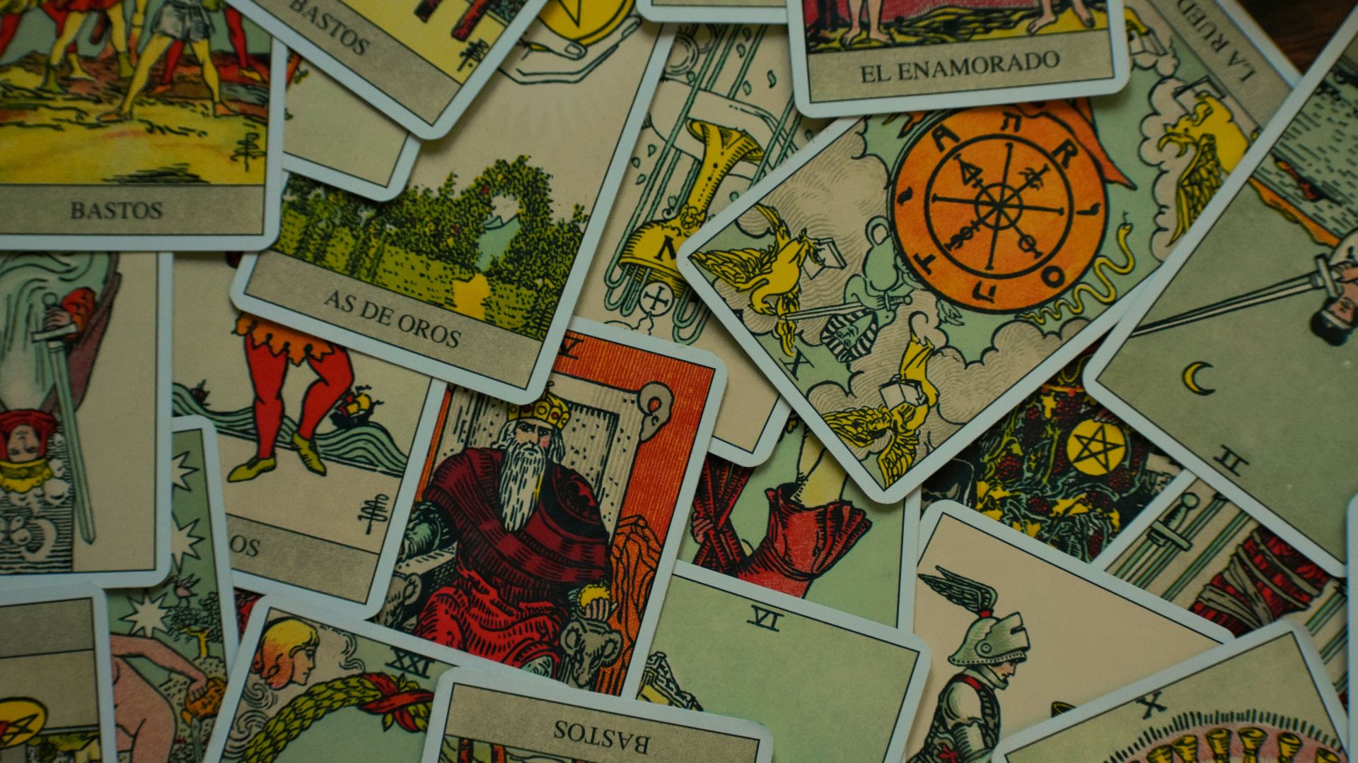 a pile of playing cards sitting on top of a table