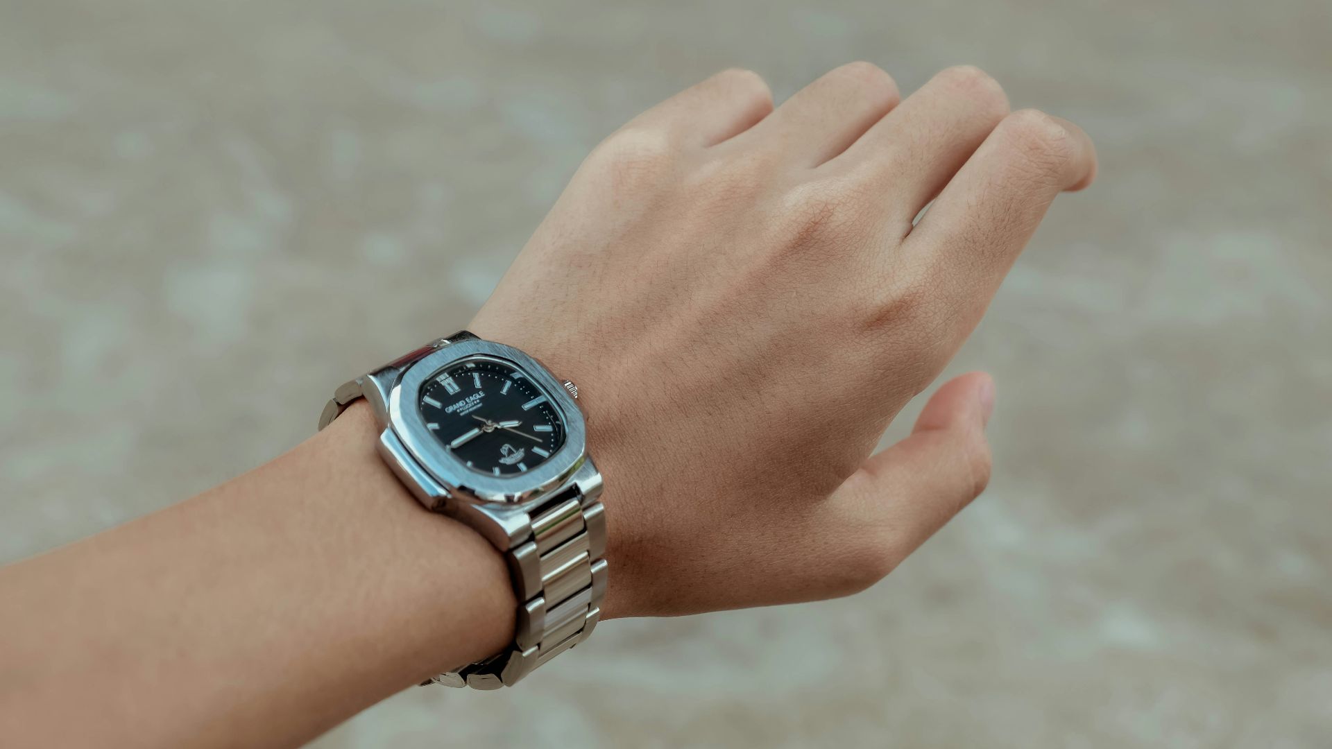 A person with a watch on their wrist