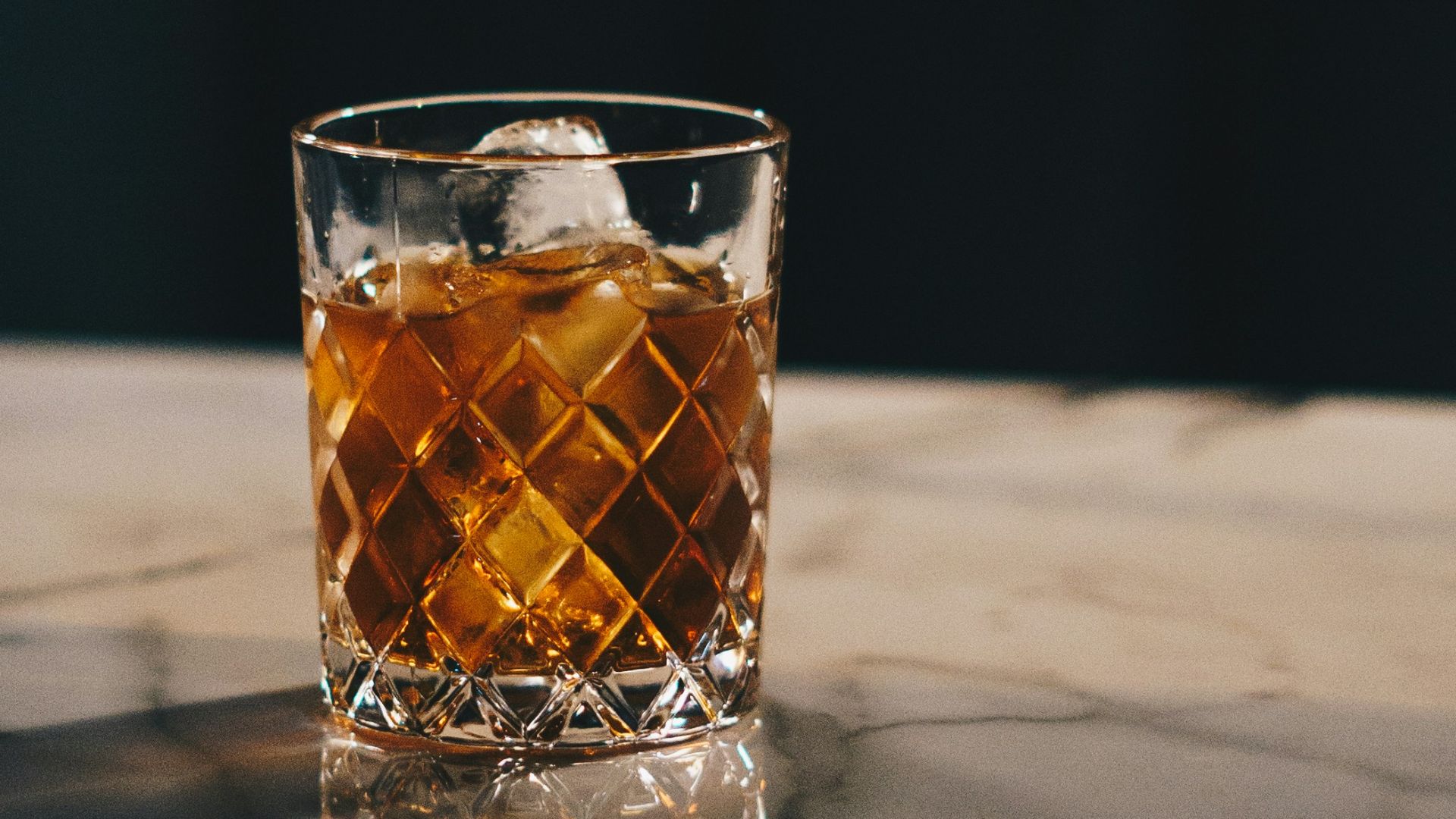 clear drinking glass with yellow liquid